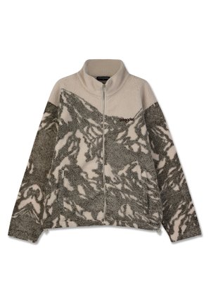 Fleecejakke med høy krage, glidelås og abstrakte grå og kremfargede mønstre. Myk tekstur med to sidelommer.