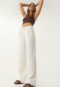 Stradivarius FLOWING - Trousers - beige