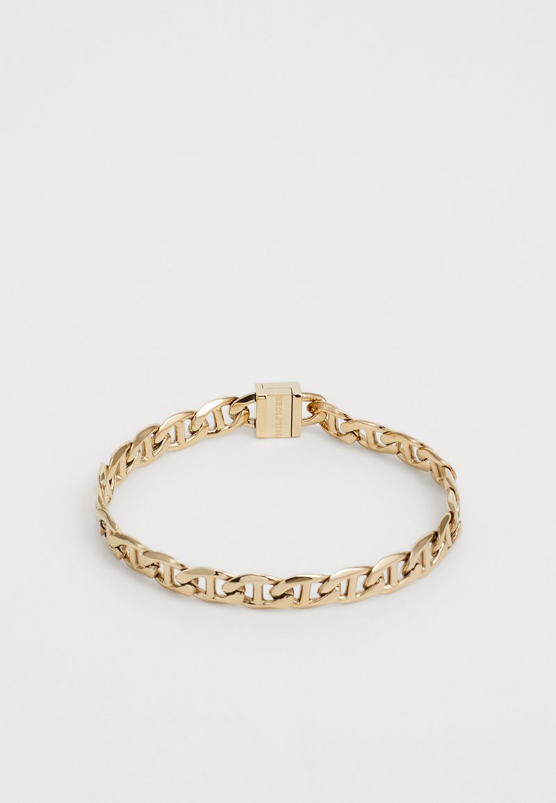 Gold metal chain bracelet with interlocking links and a clasp closure, featuring a smooth, polished finish and a simple, elegant design.
