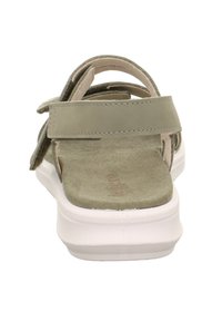 Grüne Sandalen mit verstellbaren Riemen, weichem Wildleder-Innenfutter und strapazierfähiger weißer Gummisohle. Minimalistisches Design und offene Fersen-Konstruktion.