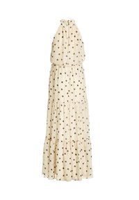 Robe longue sans manches de couleur crème avec des volants superposés et des pois noirs, avec un col licou et une taille cintrée.