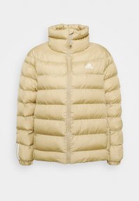 Bēšas pūkainā jaka ar horizontālu izšuvuma dizainu, augstu apkakli, pilnu rāvējslēdzēju un baltu adidas logotipu kreisajā krūtīs. Rievotas aproces uz piedurknēm.