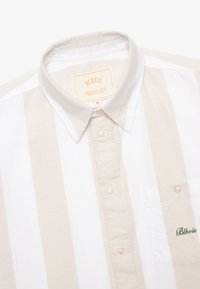 Short-sleeve button-up shirt in beige and white stripes. Cotton fabric, classic collar, front pocket with "Blkvis" embroidery, plastic buttons.