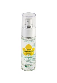 Bottiglia di vetro trasparente con ugello spray argento e cappuccio in plastica trasparente. L'etichetta presenta grafiche di fiori gialli e testo verde.