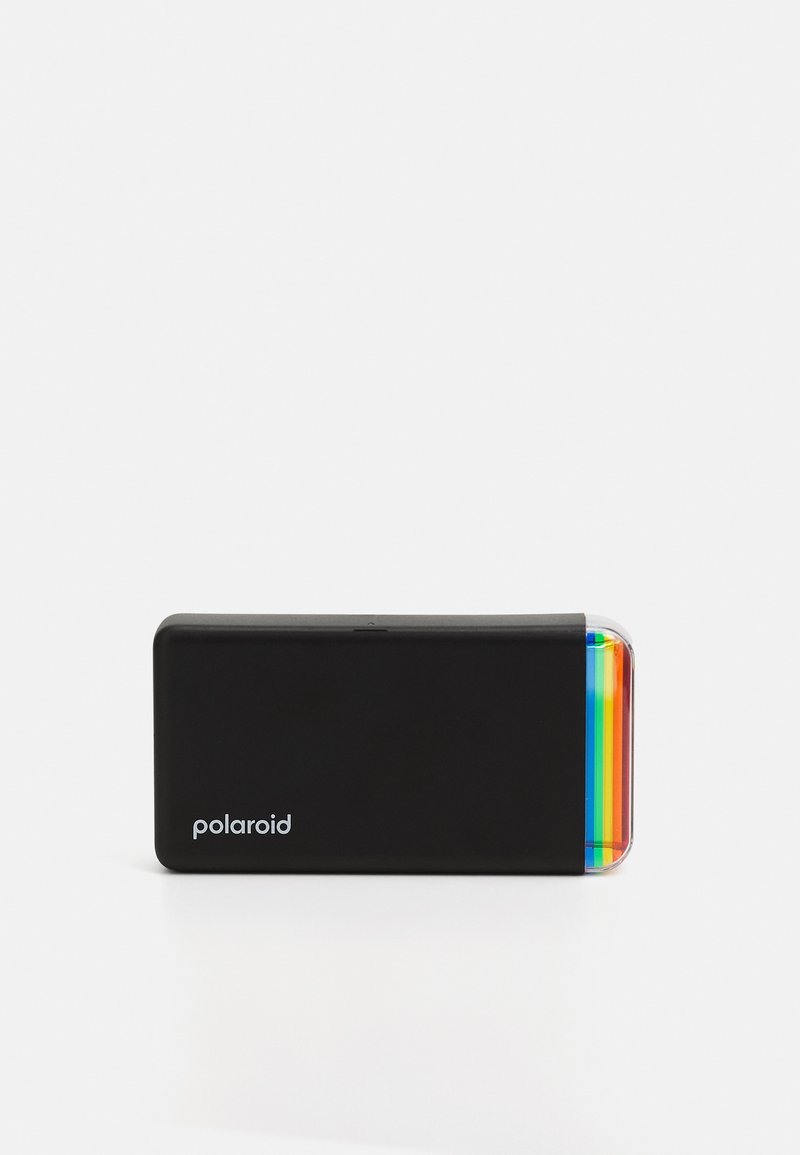Polaroid direkte foto skrivers i svart, med avrundede kanter, og en farget stribe på én side. Kompakt rektangulært design med en glatt tekstur.