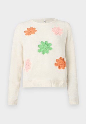 Kremfarget genser med fem broderte blomster i rosa, oransje og grønn. Ribbestrikkede mansjetter og hem. Myk tekstur med en avslappet passform.