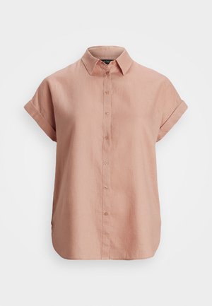 Chemise à manches courtes avec boutons dans une teinte rose doux. Fabriquée en tissu léger, elle possède un col, des poignets roulés et une coupe décontractée.