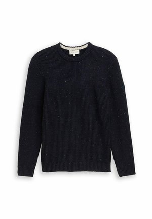 Tumedat sinise värvi kudumiga kampsun, millel on soonikkoes, ümar kaelus ja peened täpikestega detailid üle kogu campsuni. Pikad varrukad ja lõdva istuvusega.