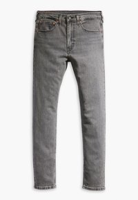 Jeans de denim gris con cierre de botón y cremallera, diseño de cinco bolsillos, piernas ligeramente ajustadas y costuras visibles.