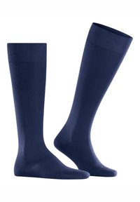 Calze al ginocchio blu navy realizzate in tessuto liscio con polsini a coste, dotate di punta senza cuciture e di una forma aderente per un comfort ottimale.
