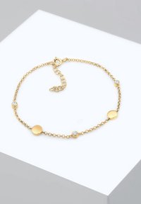 Bracciale in tono oro con anelli rotondi, caratterizzato da cerchi lisci alternati a cristalli trasparenti. Include una chiusura a moschettone e una catena regolabile.