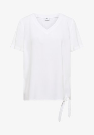 Blusa blanca de manga corta con escote en V y detalle de lazo lateral en el dobladillo, hecha de tela suave.