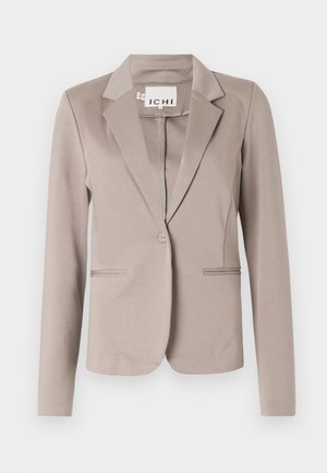 Blazer bege com fecho de botão único, lapelas notched e dois bolsos frontais. Feito de um tecido liso e texturizado; ajuste ajustado.