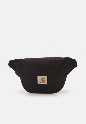 Sac banane Carhartt noir avec poche avant zippée et écusson carré blanc avec icône jaune et texte rouge.