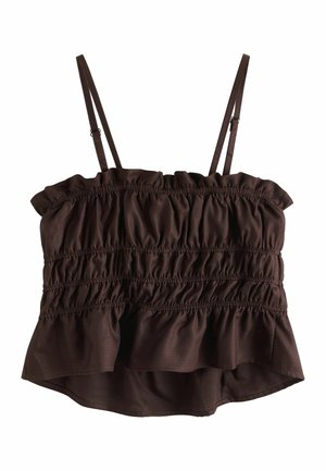 Pruun varrukateta lühike topp reguleeritavate spagetipõhiste rihmade ja kortsus, kogutud kangamustriga rinnaosa ja ääre kohal.