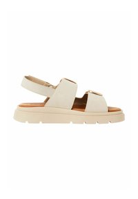 Beige sandals with two wide straps and adjustable heel strap. Thick, light-colored rubber sole with ridged texture. Minimalist design.