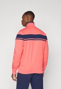 Sergio Tacchini DAMARINDO TRACKTOP - Športna jopa s kapuco na zadrgo - dubarry/maritime blue