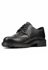 Chaussure en cuir noir à lacets avec des détails en brogue, bout rond et semelle texturée. Présente un talon bas empilé et une finition lisse.