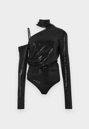 Top nero con paillettes, design asimmetrico, con una manica lunga e colletto alto. Il corpo è integrato in un fondo nero aderente.