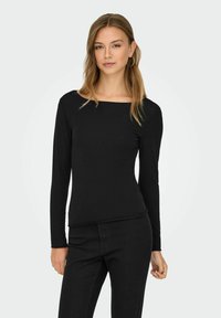 Zwarte lange mouw top met een vierkante halslijn, slim fit en zachte stof. Gecombineerd met zwarte jeans, met een naadloos ontwerp en zonder patronen.
