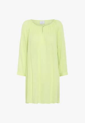 Šviesiai geltona, pusiau permatoma tunika su ilgomis rankovėmis, apvalia iškirpte ir mažomis mygtukų detalėmis priekyje. Minkšta, plaukianti medžiaga.