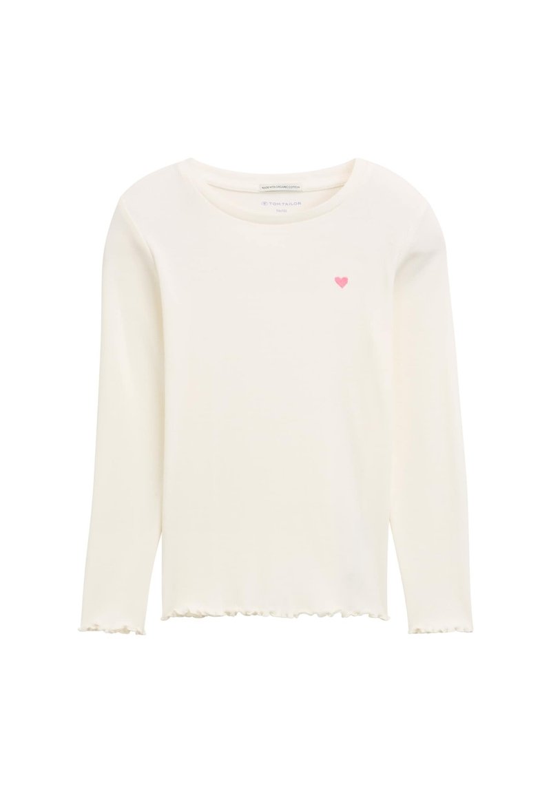 Camicia a maniche lunghe color crema realizzata in tessuto morbido, con scollatura rotonda, orlo arricciato e un piccolo ricamo a forma di cuore rosa sul petto.