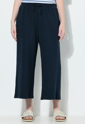 Navyblauwe brede broek van lichtgewicht stof met een gestructureerde afwerking, voorzien van een elastische tailleband en trekkoord voor een verstelbare pasvorm.