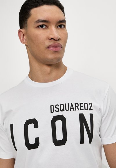 White cotton t-shirt featuring bold black text "DSQUARED2 ICON" on the front. Crew neck design with short sleeves. Smooth texture.