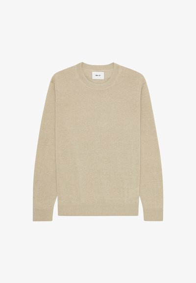 Beige long-sleeve crew neck sweater with ribbed cuffs and hem, featuring a small white label inside the neckline.