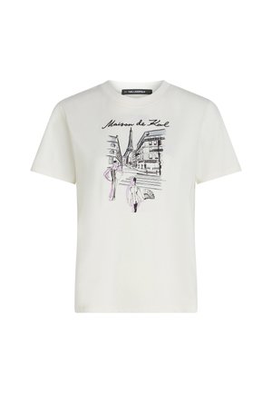 T-shirt in cotone bianco con stampa grafica di una scena urbana, con edifici e figure decorati da accenti neri e viola.