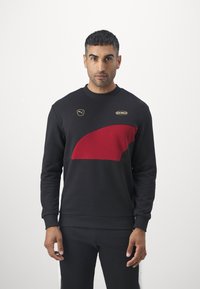 Puma KING CREW - Felpa - black/intense red