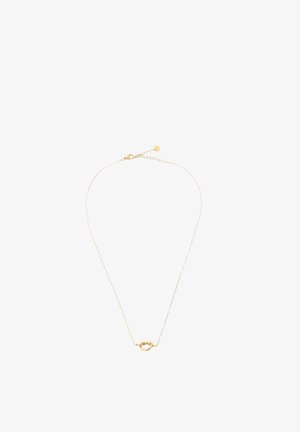 Fijne gouden ketting met een klein, verweven knoopje als hanger, gecentreerd op een witte achtergrond.