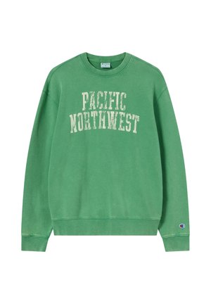 Grüner Sweatshirt mit Rundhalsausschnitt, auf der Brust "PACIFIC NORTHWEST" in weißer, abgenutzter Schrift und kleinem Champion-Logo am linken Ärmelbündchen.