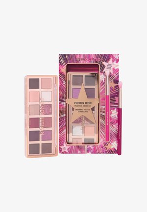 Palette de fards à paupières Cherry Icon avec 12 teintes de roses et violettes, présentée dans un emballage aux accents dorés avec deux pinceaux.