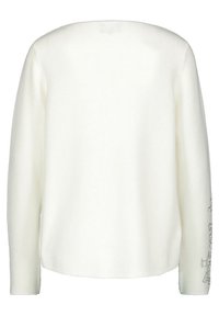 Maglione bianco a maglia con maniche lunghe e scollatura rotonda. La texture è morbida, con motivi discreti sulle maniche.