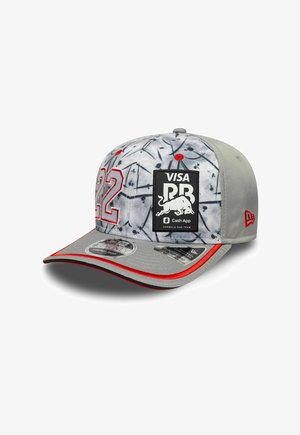Gray cap with a tie-dye pattern, red accents, front embroidered with the number "22" and a black logo patch. Features a curved brim.