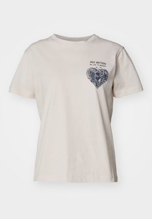 T-shirt en coton beige à manches courtes, avec un graphique en forme de cœur marine sur la poitrine gauche, avec du texte au-dessus. Coupe régulière.