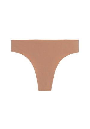 Nude-colored thong made of smooth, stretchy fabric. Features a low-rise waist and minimal coverage with no visible seams.