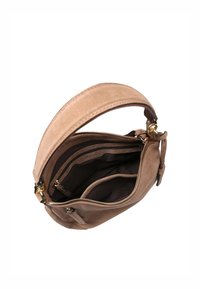 Round, tan suede handbag with a zipper closure, featuring a soft texture, a short handle, and multiple interior compartments in dark fabric.