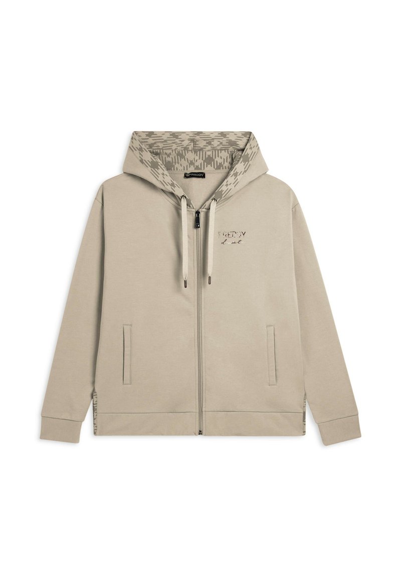 Felpa zip beige chiara con fodera a motivo nel cappuccio, tasche anteriori, coulisse regolabile e un piccolo logo sul petto.