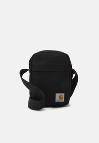 Borsa a tracolla in tessuto nero con cinturino regolabile, scomparto principale con zip, tasca frontale e vistoso patch del logo Carhartt arancione.