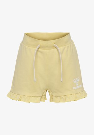 Gule bomulds shorts med en bølget kant, elastisk talje og hvide snore. Har et hvidt logo på forsiden.