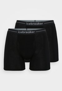 Melnas bokseru apakšbikses, izgatavotas no mīksta, elastīga auduma, ar pelēku jostu, kurā melnbaltā krāsā ir izdrukāts zīmols "icebreaker".