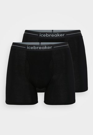 Boxers pretos feitos de um tecido suave e elástico, com uma cintura cinza onde está impresso o nome da marca "icebreaker" em preto e branco.