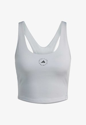 Light gray athletic crop top with a scoop neckline and cross-back straps. Features a small black circular logo at the center front.