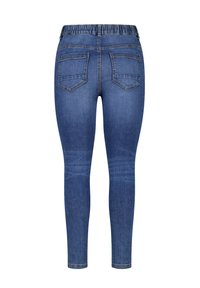 Jeggings en denim bleu avec une taille élastique, présentant deux poches arrière et un design de jambe ajustée, mettant en valeur une texture lisse et un délavage moyen.