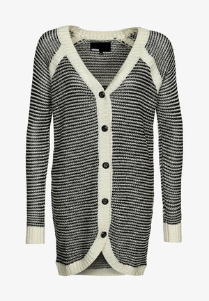 Musta-valkoraitainen neulecardigan, jossa on kermaisen värinen reunus, pitkät hihat, V-aukko ja viisi mustaa nappia edessä.