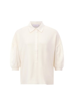 Cream-colored short-sleeve blouse with a button-down front and a collar. Features puffed sleeves and a relaxed fit, made from smooth fabric.