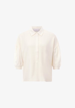 Cream-colored short-sleeve blouse with a button-down front and a collar. Features puffed sleeves and a relaxed fit, made from smooth fabric.