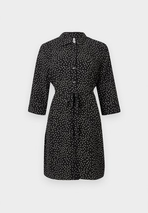 Rochie neagră până la genunchi cu buline albe, cu nasturi în față, mâneci trei sferturi, guler și curea legată în talie.